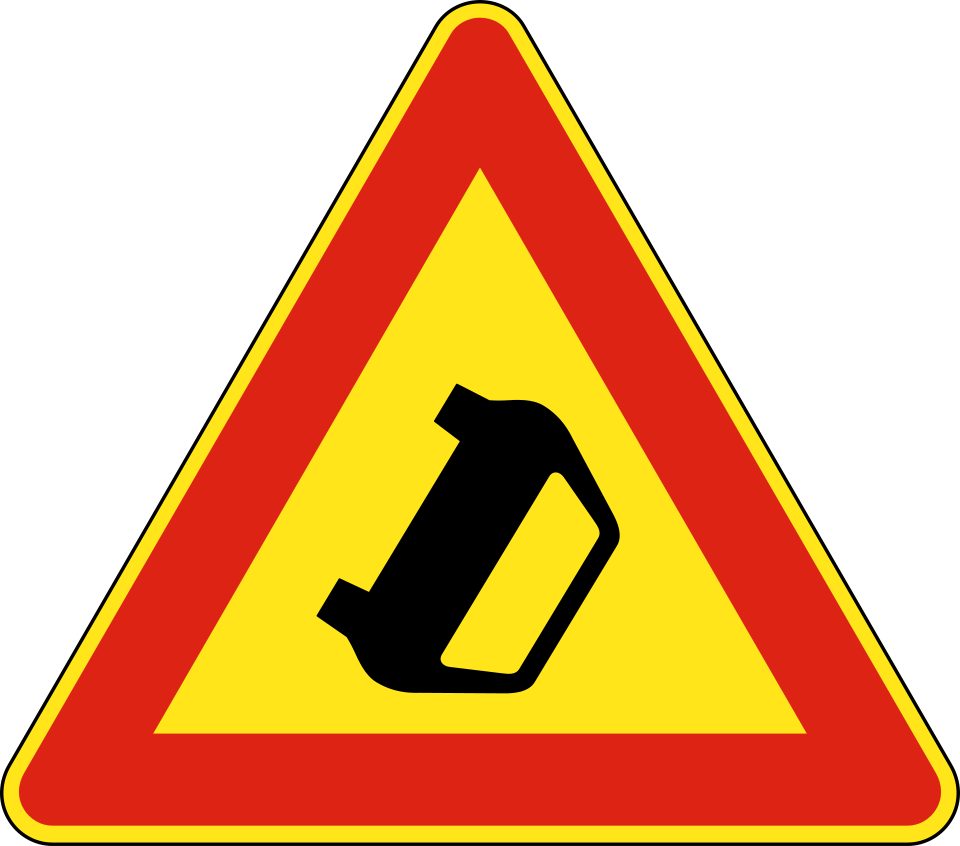 Red-bordered triangle containing a tilted car silhouette.