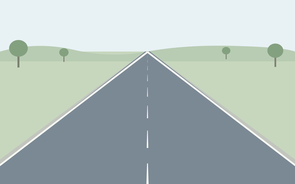A rural two-way road with one lane in each direction, separated by a broken centre line.