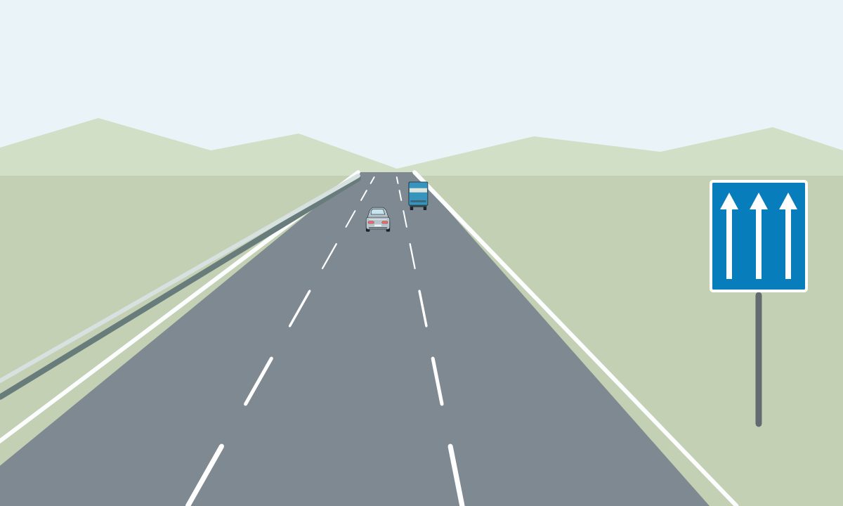 Three marked lanes with a blue sign showing three upward arrows, a distant silver car and a blue-and-white truck.