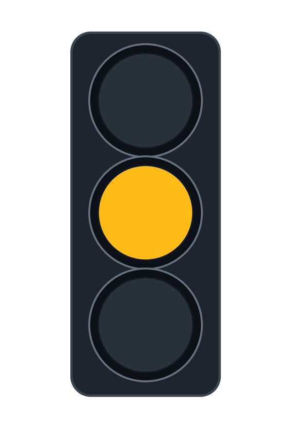 Vertical three-lamp traffic signal showing a steady amber lamp in the middle.