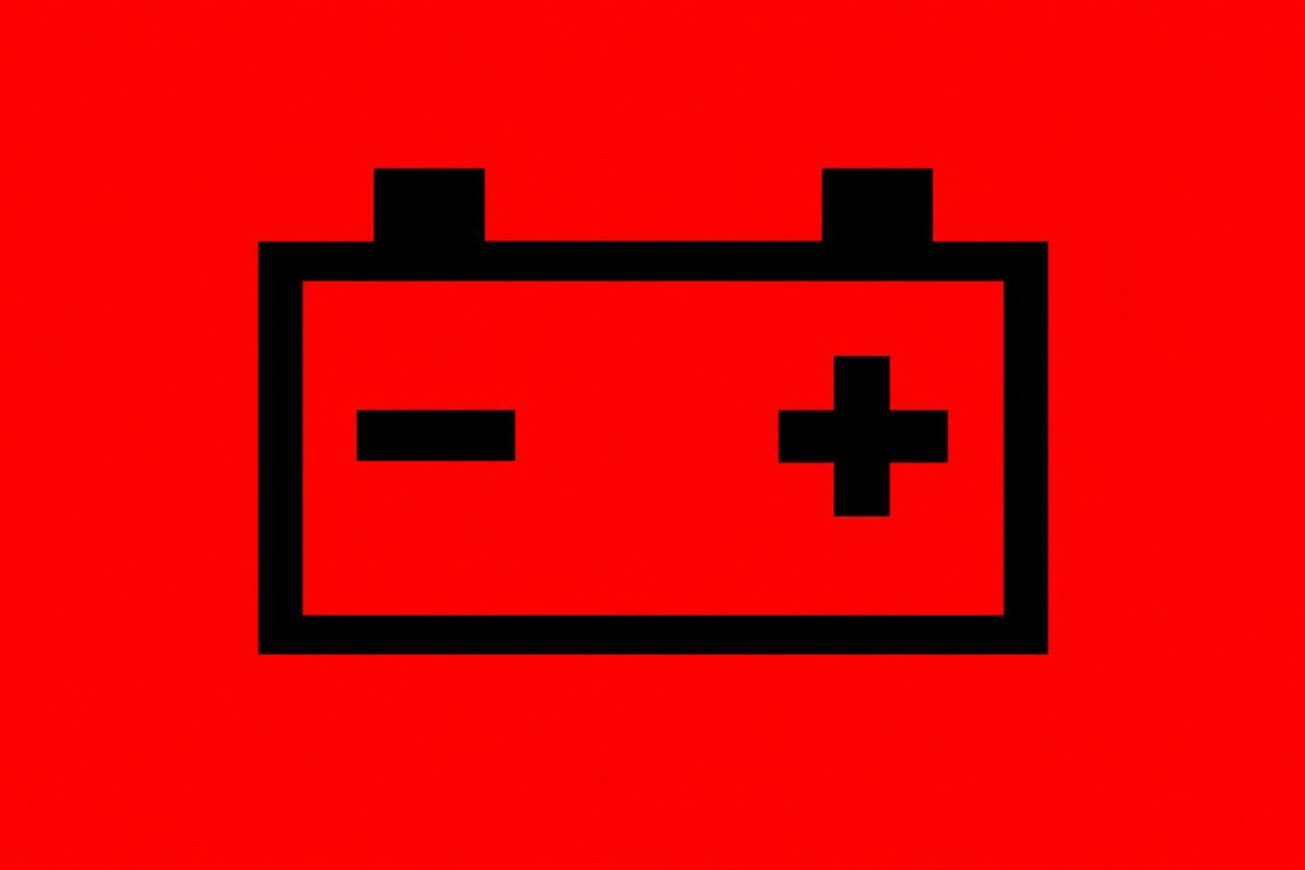 Black rectangular outline with two top tabs, a minus on the left and a plus on the right, on red.
