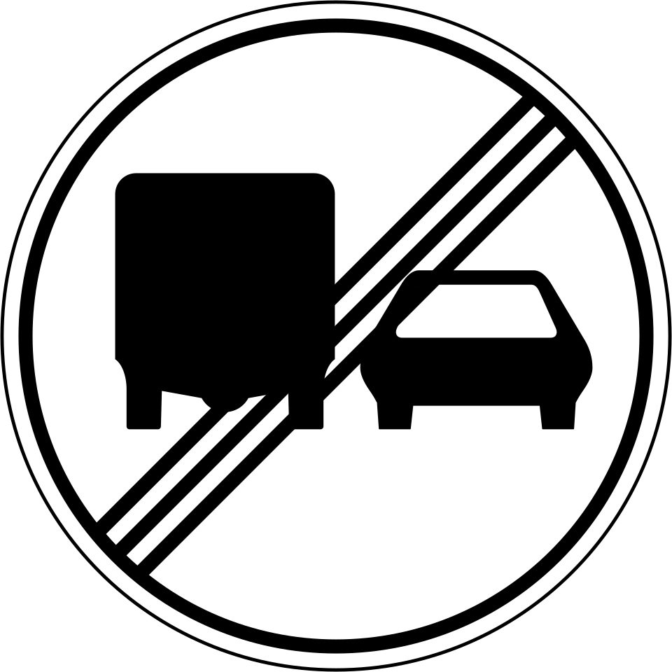 White circular sign with a black border, a lorry at left and a car at right, crossed by three black diagonal bars rising to the right.