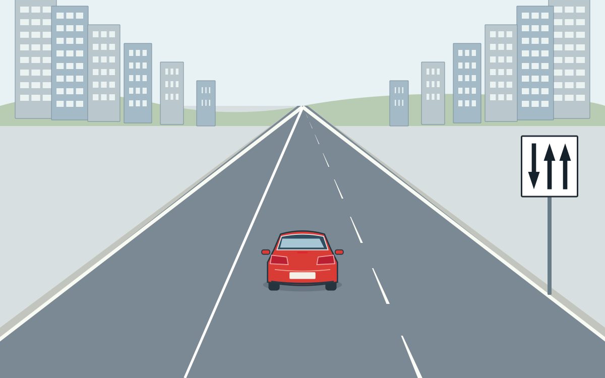 A red car travelling away in the middle lane of a three-lane urban road with a solid left internal divider and a broken right internal divider; a white rectangular panel with a black border at the right has three black arrows: down, up, up from left to right.