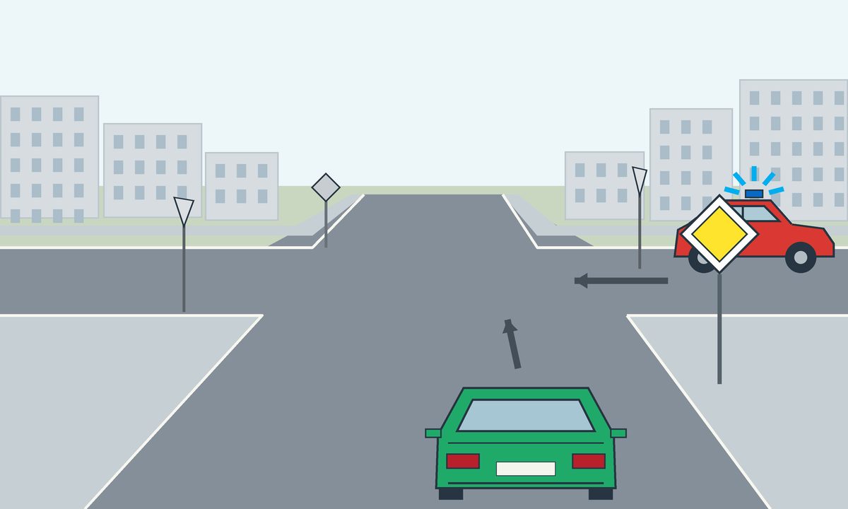 A green car and a red vehicle at a junction with arrows and roadside signs.