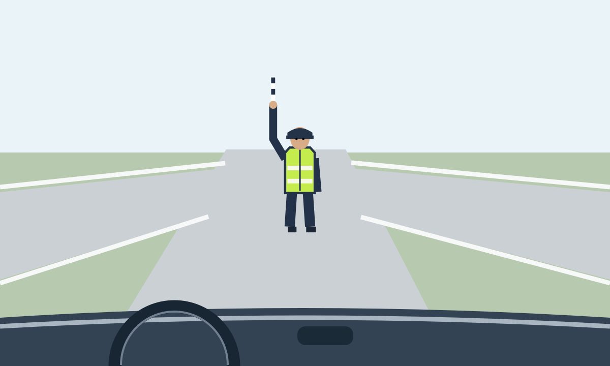 View through a windscreen towards a controller facing the driver, with his right arm and striped baton raised vertically and his left arm lowered.
