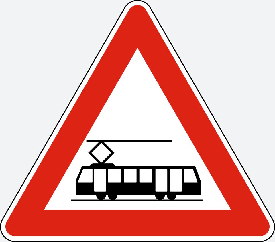 Red-bordered upright triangle; black side view of a tram with overhead contact equipment.