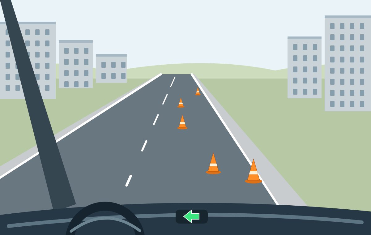 Driver view with a left indicator and five orange cones forming a boundary across the right side of the carriageway.