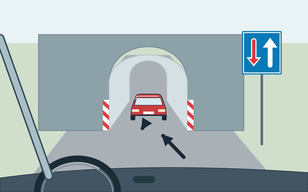 View through a windscreen toward a narrow arched underpass. A red car facing the viewer is between the portals, with a short arrow toward the near opening. A blue sign at right has a red down arrow left and a white up arrow right; a forward arrow is ahead of the windscreen.