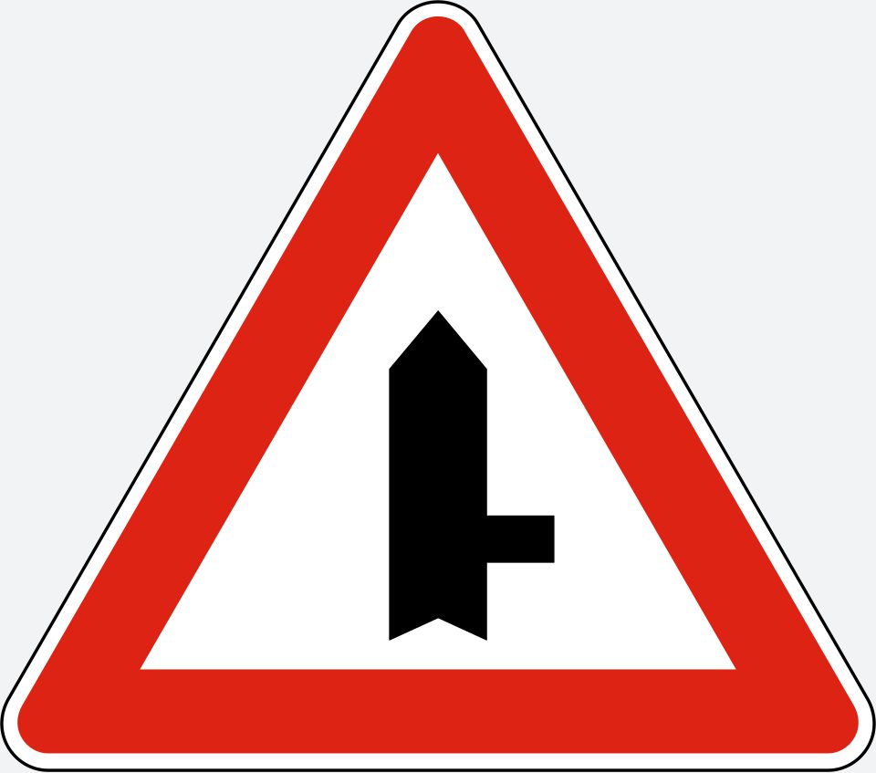 Red-bordered upright triangle; thick upright arrow-topped stem with a thinner branch to the right.