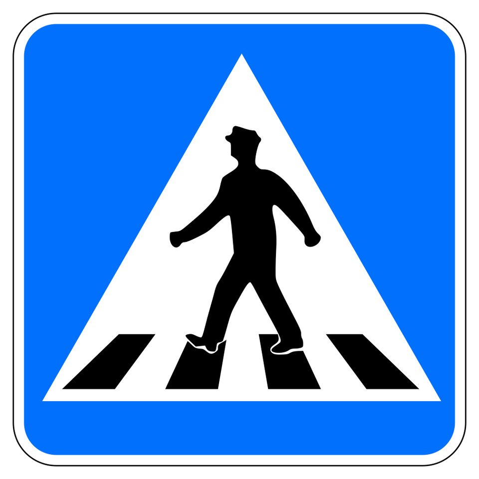 Blue square with a white triangle containing a black walking person over crossing stripes.