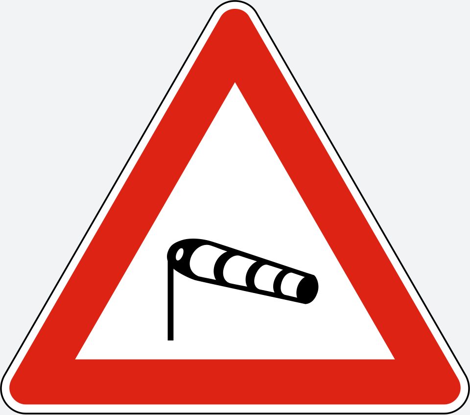 Upright white triangle with a red border; a black pole on the left supports a striped windsock extending to the right.