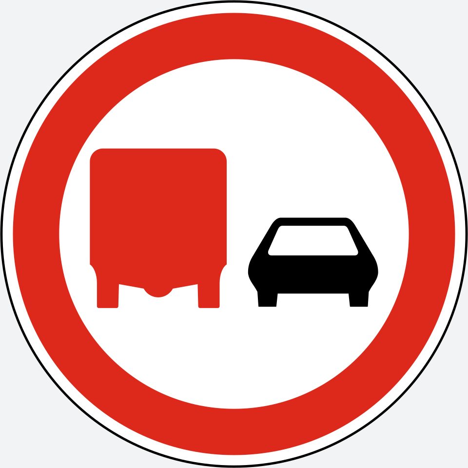 White circle with a red border; a red truck silhouette on the left and a black car silhouette on the right, both viewed from the front.