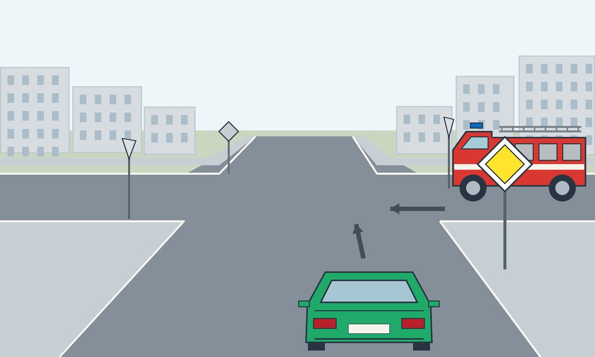 A green car and a red fire engine at a junction with roadside signs.
