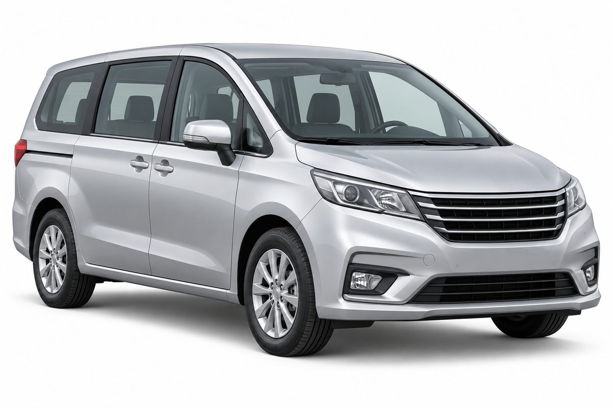 Silver passenger minivan with an enclosed cabin and road tyres.