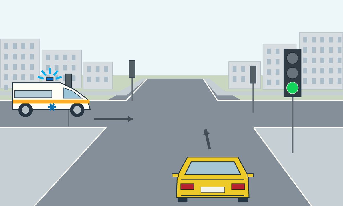 A yellow car and an ambulance at a junction, with arrows and a green traffic light.
